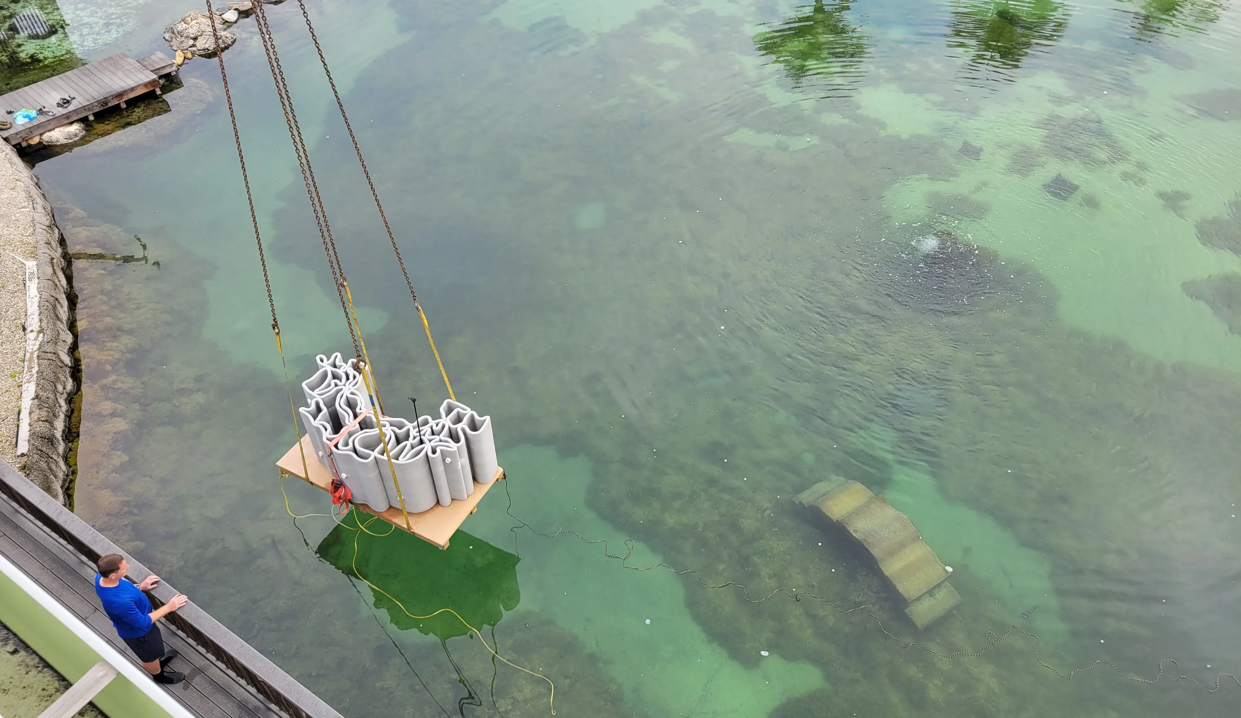 A 3D printed reef being lowered into the Gamefish Lagoon at the Florida Oceanographic Center during installation