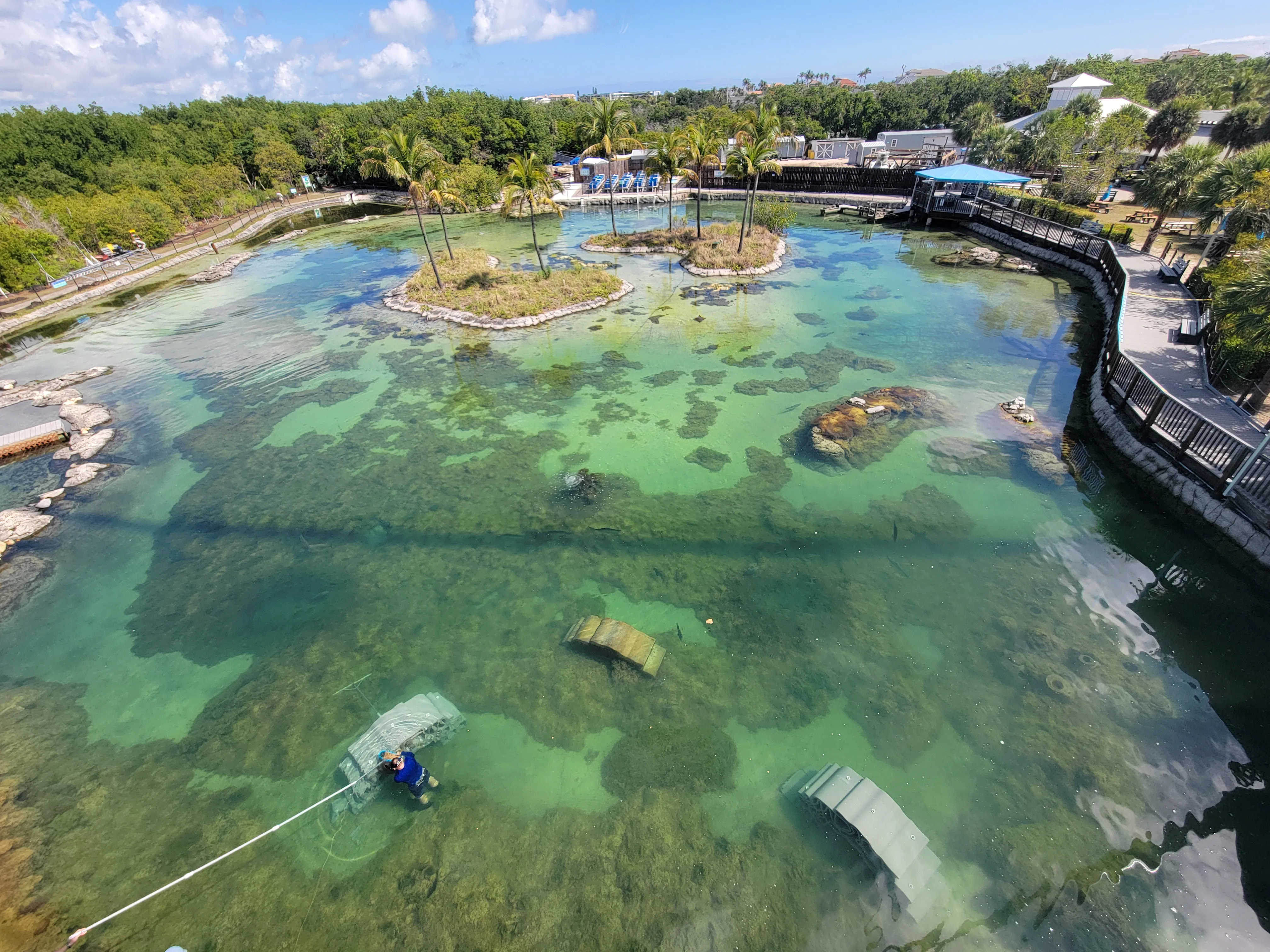 Aerial view of three 3D printed reefs submerged in the Gamefish Lagoon at the Florida Oceanographic Center