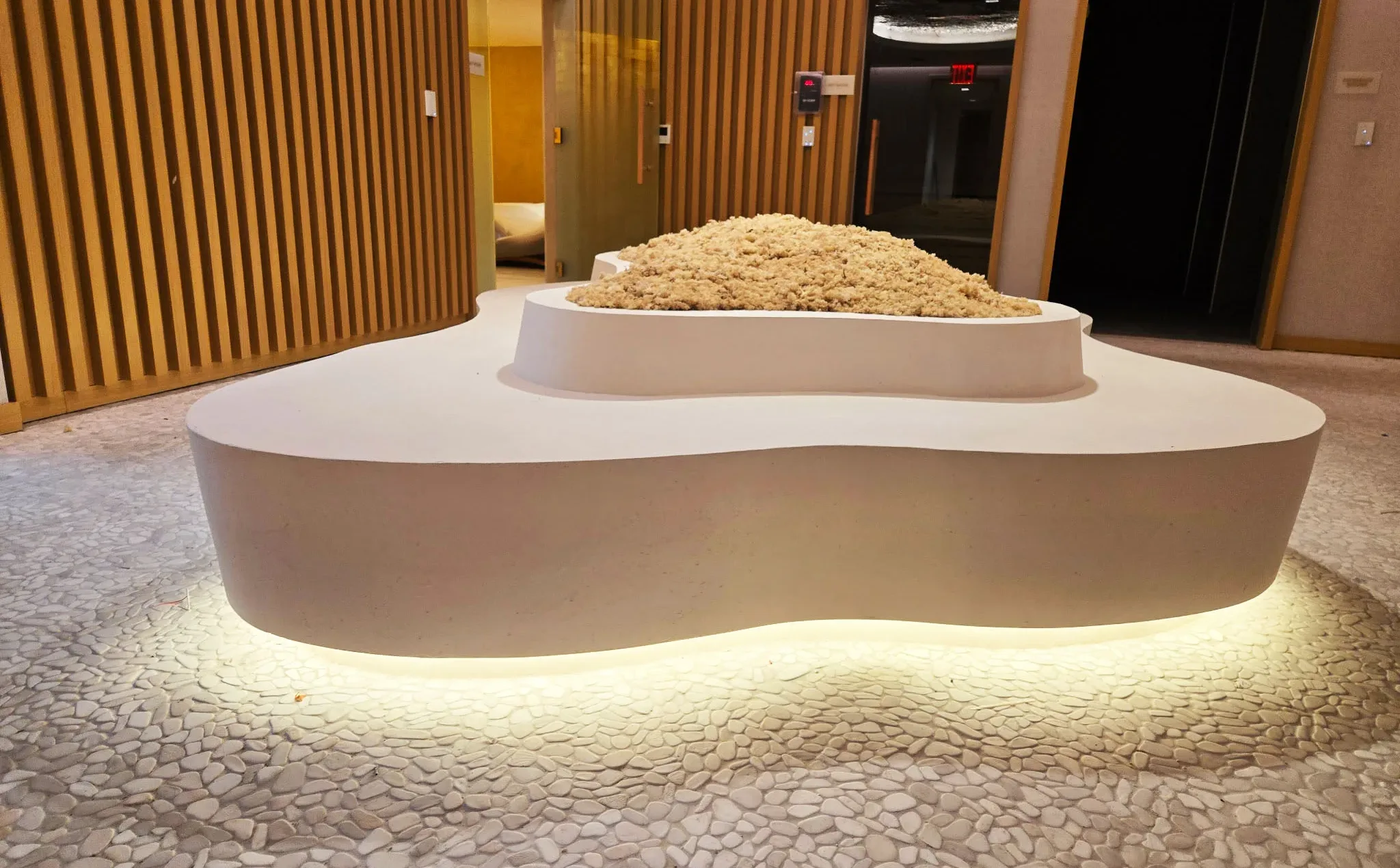 Custom concrete planter bench hybrid in spa area at 25 Water Street project