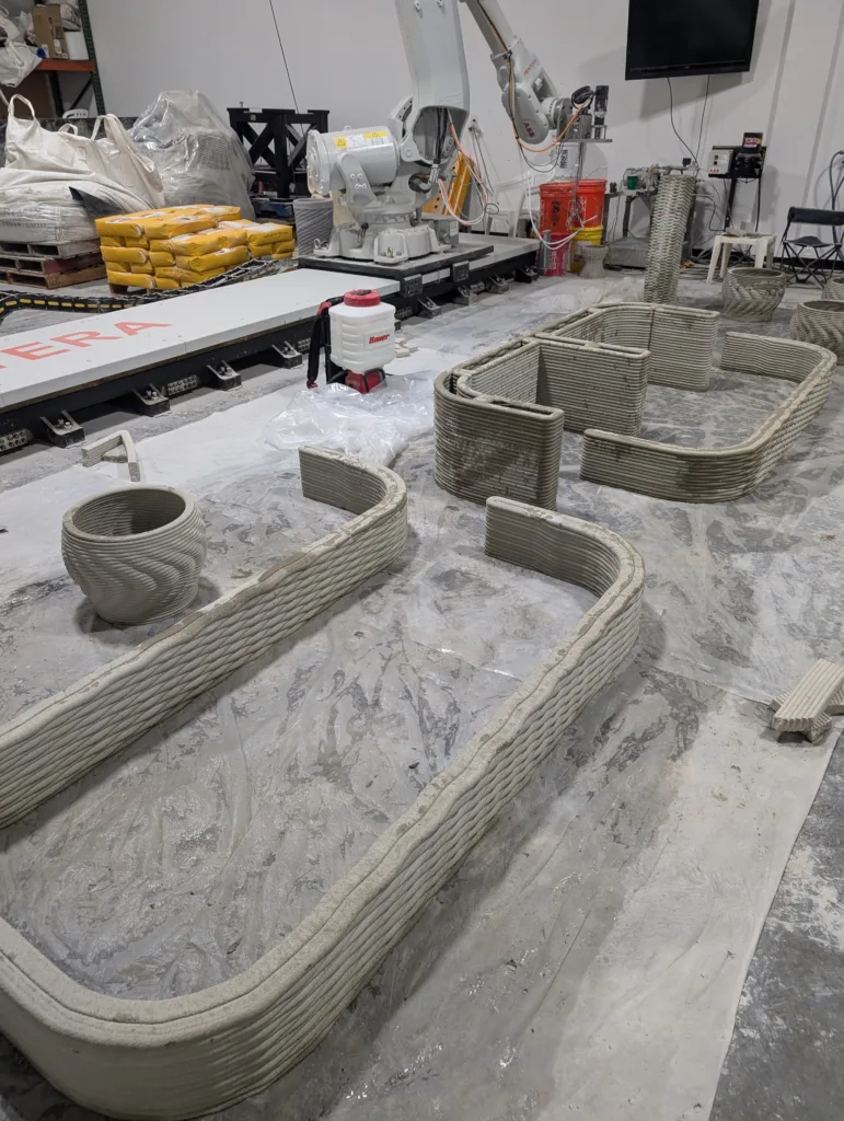 3D concrete printing of custom park benches for Citizen Robotics project, showing the printing process in action.