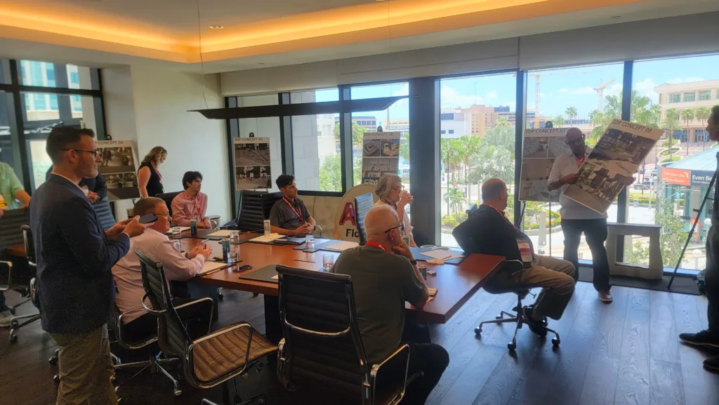 Participants at AIA Florida 2025 examining custom 3DCP concrete designs during the focus group session.