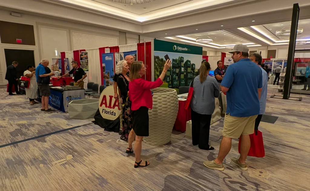 Oldcastle APG booth at AIA Florida showcasing collaborative 3D concrete printing projects with Printera.