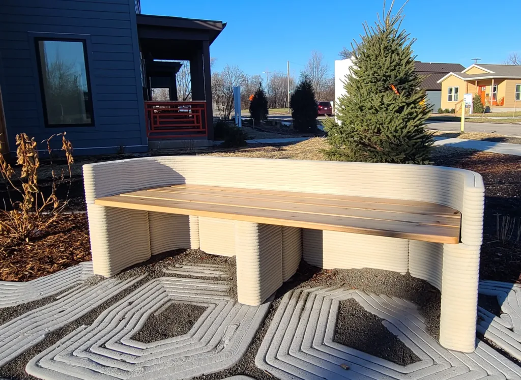 Decorative concrete park bench with 3D printed base and wood top