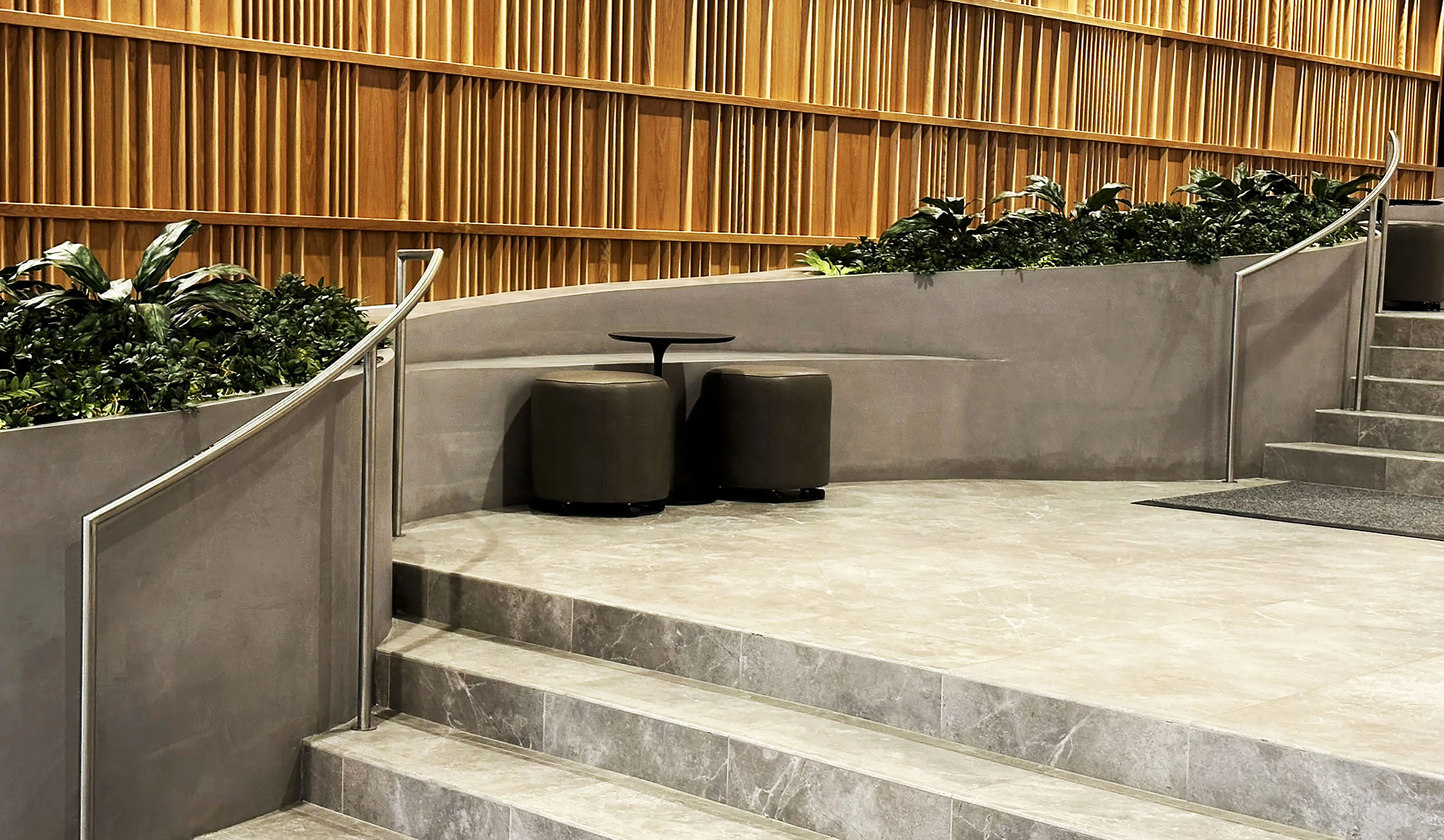 Close-up of the 3D printed concrete seating nook in the main lobby of SoMa Residences at 25 Water in New York City.